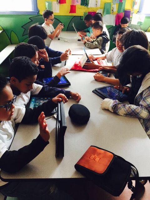 Children using technology in the classroom